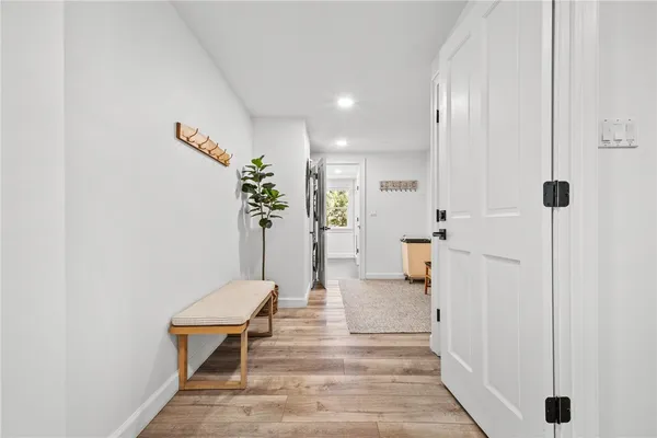 a view of livingroom with furniture and book shelf