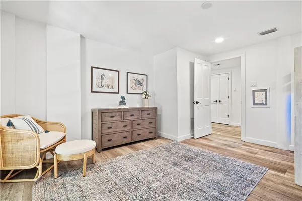 a view of kitchen with furniture and wooden floor