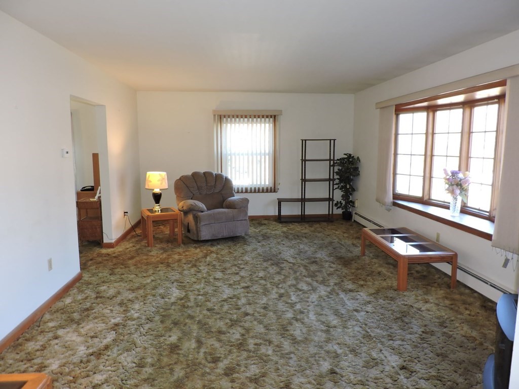110 Gore Road Webster, MA 01570 - Photo 11 of 42 a living room with furniture and a window