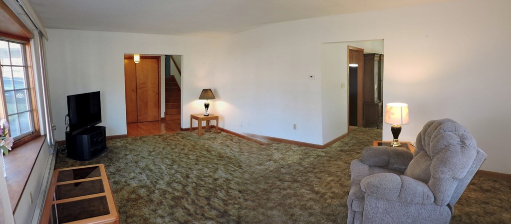 110 Gore Road Webster, MA 01570 - Photo 13 of 42 a living room with furniture and a flat screen tv
