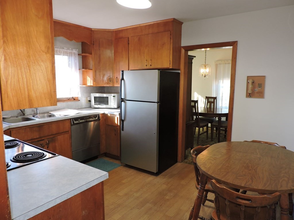 110 Gore Road Webster, MA 01570 - Photo 17 of 42 a kitchen with stainless steel appliances granite countertop a refrigerator a sink a stove and a refrigerator
