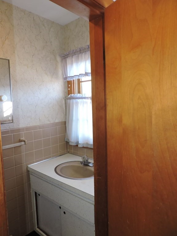 110 Gore Road Webster, MA 01570 - Photo 19 of 42 a bathroom with a sink toilet and window