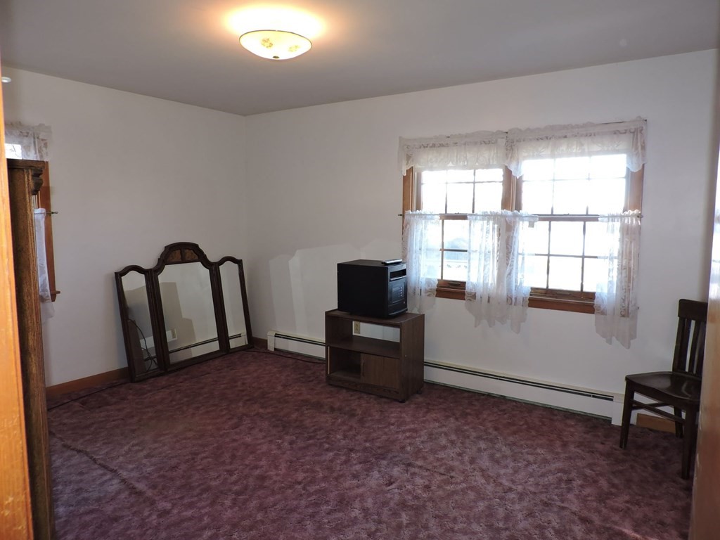110 Gore Road Webster, MA 01570 - Photo 24 of 42 a living room with furniture and a window