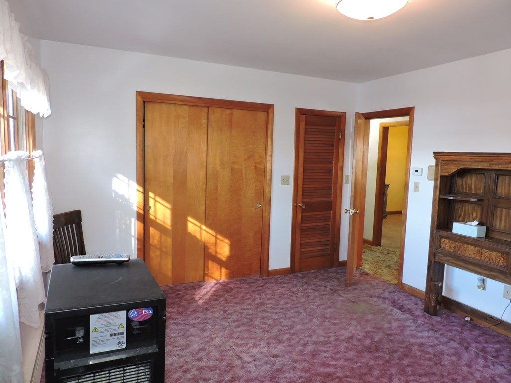 110 Gore Road Webster, MA 01570 - Photo 25 of 42 a living room with a bed furniture and a window