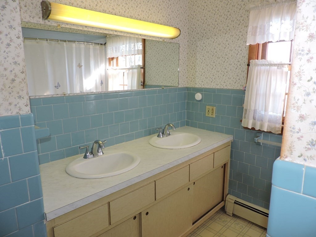 110 Gore Road Webster, MA 01570 - Photo 31 of 42 a bathroom with a sink and a mirror