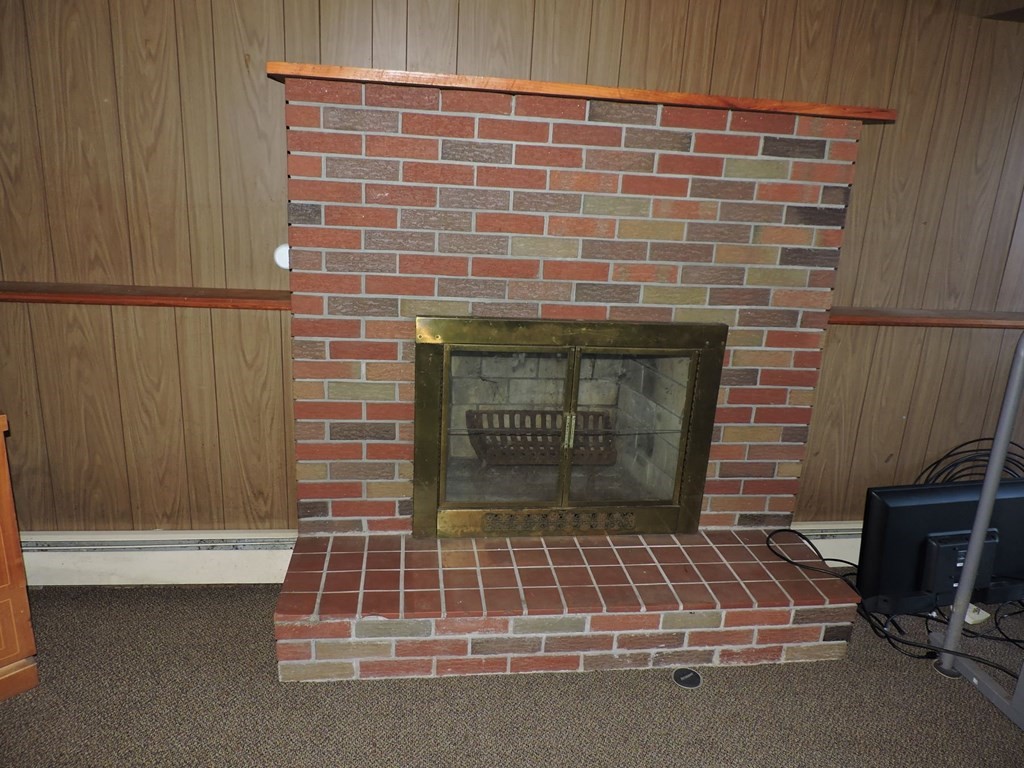 110 Gore Road Webster, MA 01570 - Photo 36 of 42 a living room with a fireplace