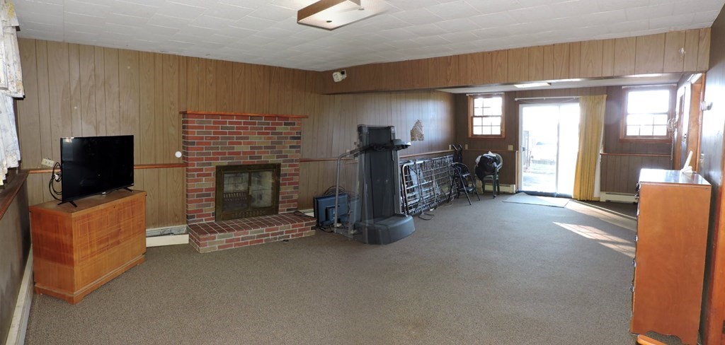 110 Gore Road Webster, MA 01570 - Photo 37 of 42 a view of livingroom with furniture and a flat screen tv