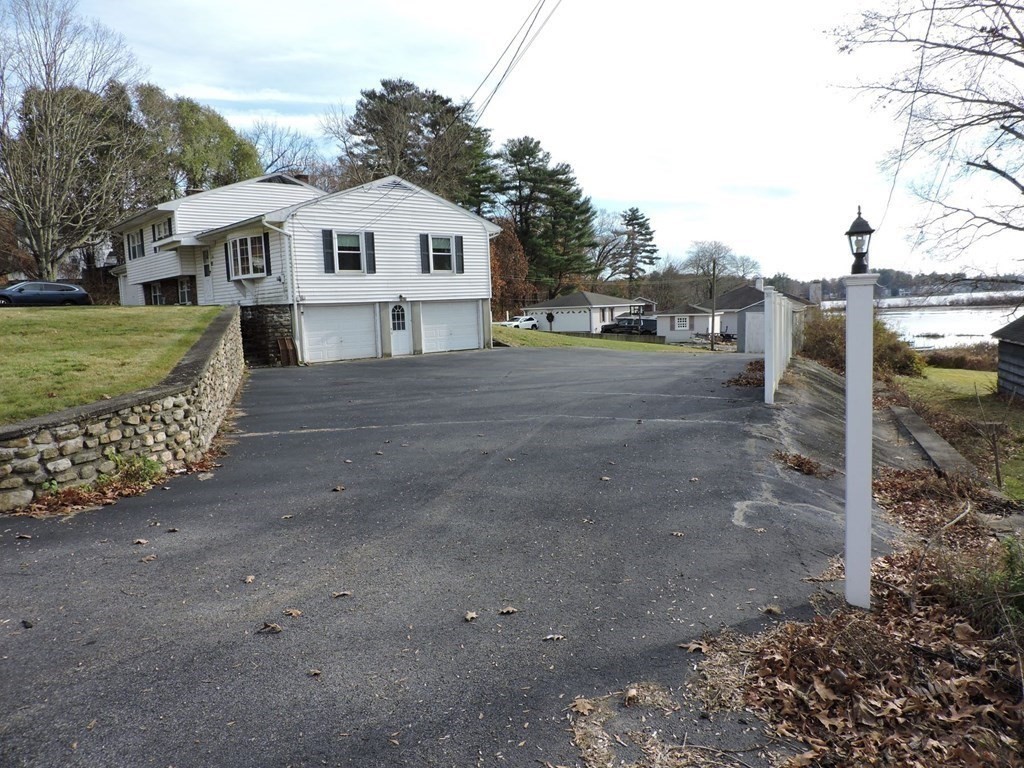 110 Gore Road Webster, MA 01570 - Photo 4 of 42 a front view of a house with a yard