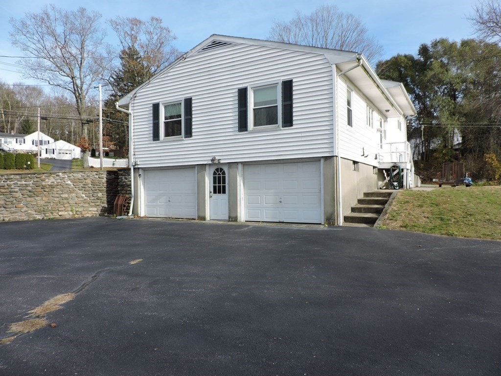 110 Gore Road Webster, MA 01570 - Photo 8 of 42 a view of a house with a yard
