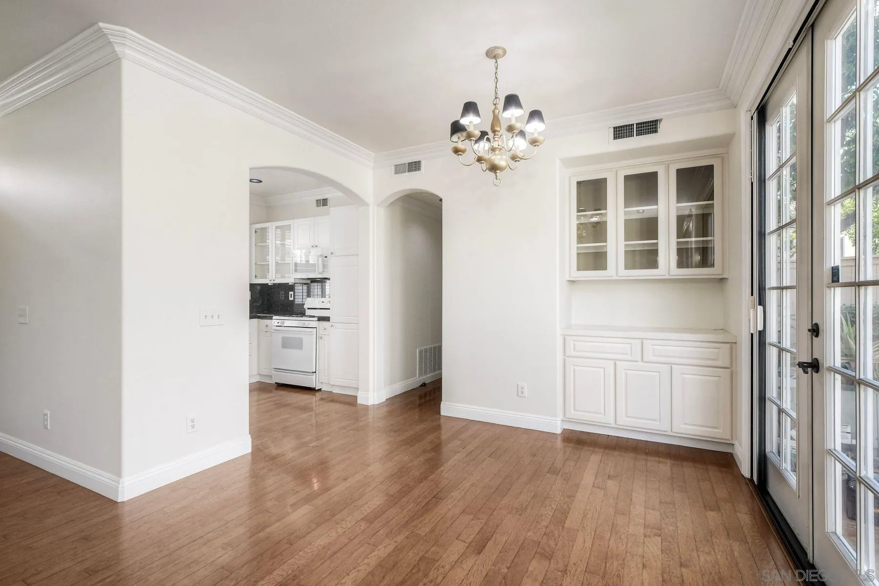 9633 Stonecrest Boulevard San Diego, CA 92123 - Photo 12 of 45 a view of a kitchen with refrigerator and cabinet