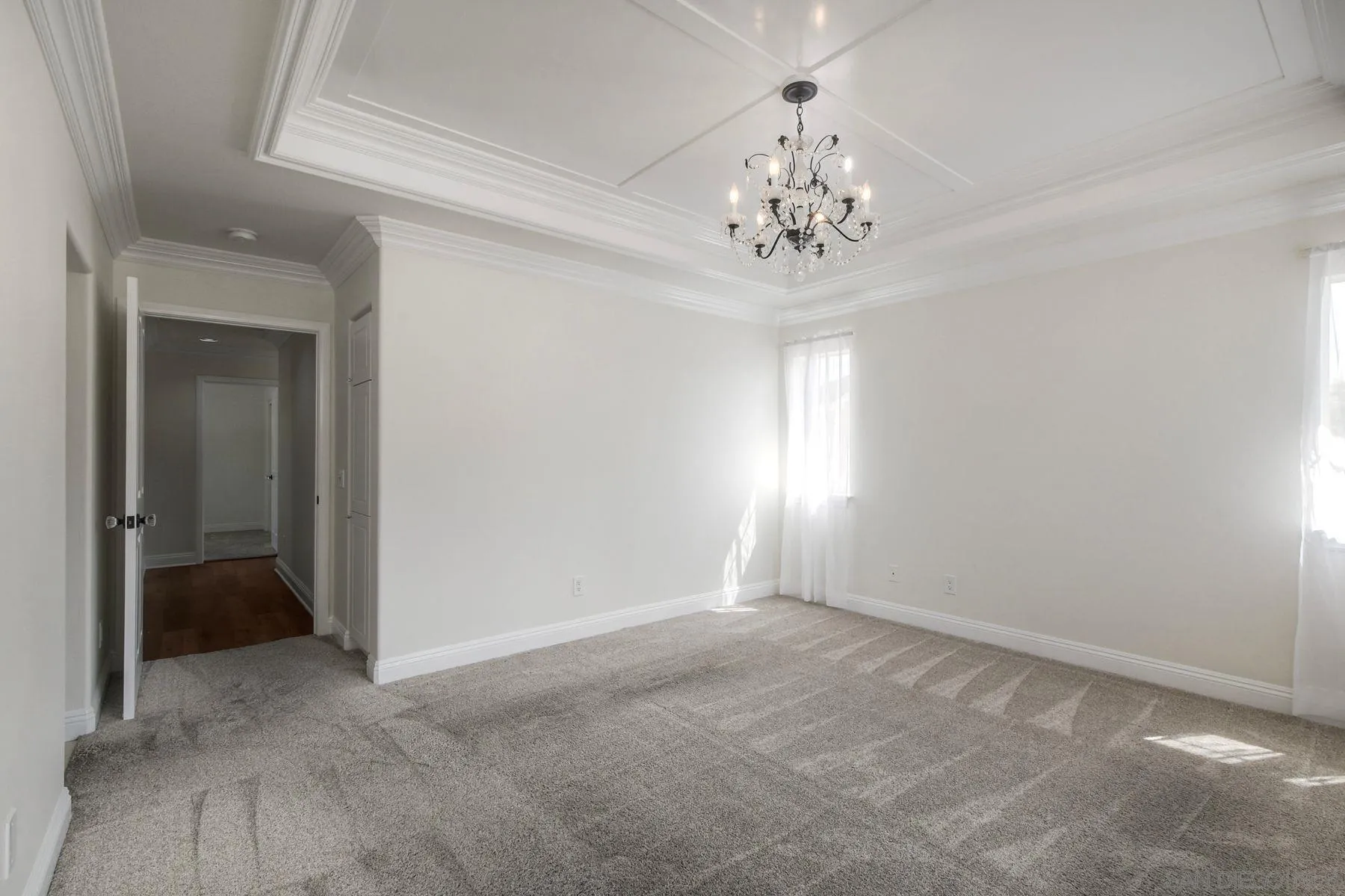 9633 Stonecrest Boulevard San Diego, CA 92123 - Photo 28 of 45 wooden floor in an empty room with a window