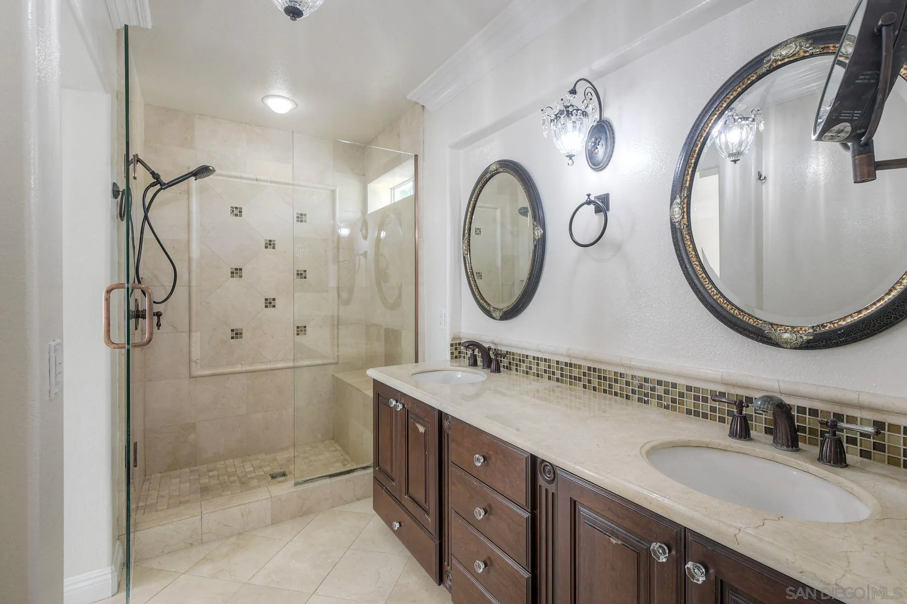 9633 Stonecrest Boulevard San Diego, CA 92123 - Photo 31 of 45 a bathroom with a double vanity sink mirror and shower