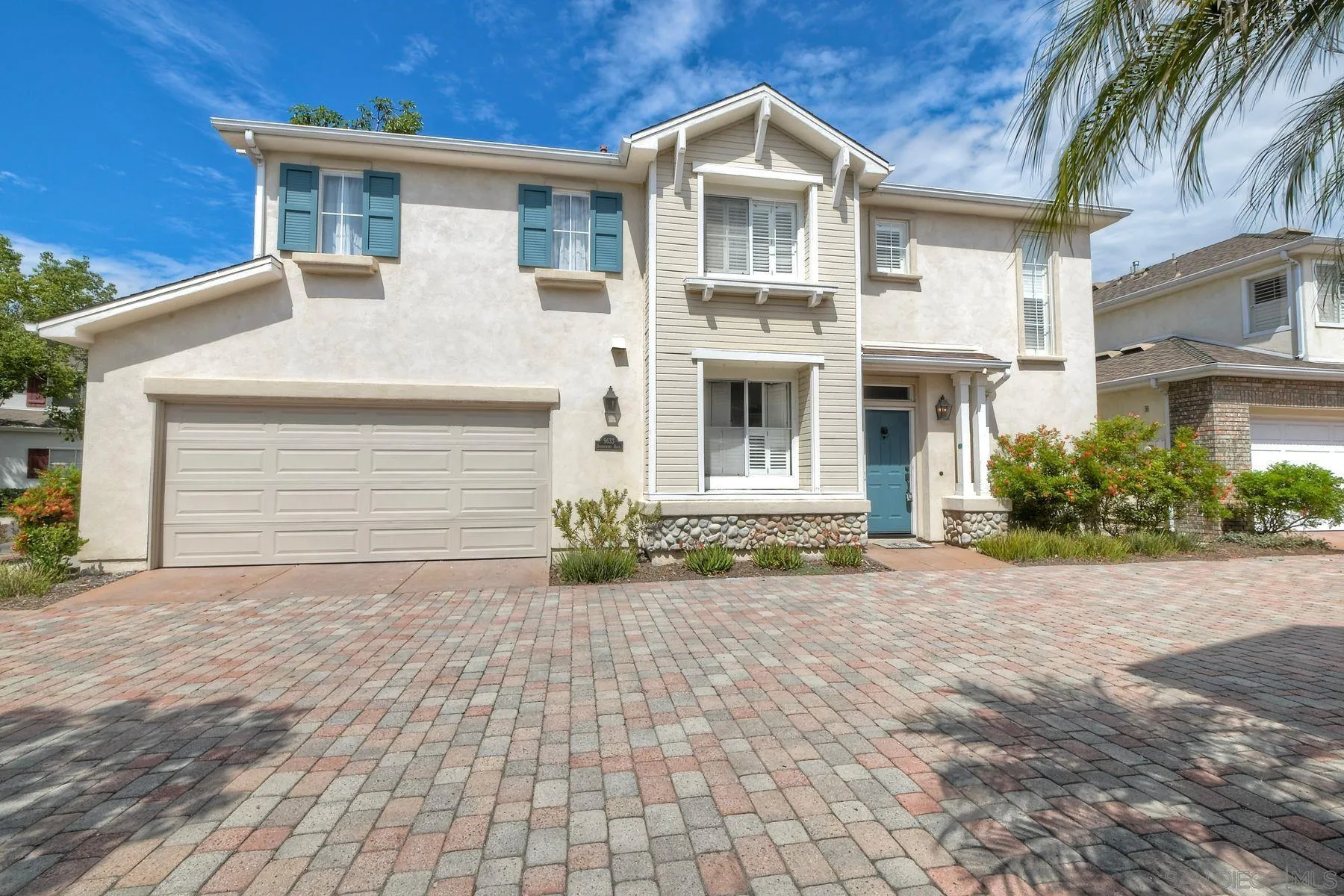 9633 Stonecrest Boulevard San Diego, CA 92123 - Photo 4 of 45 a front view of a house with a yard