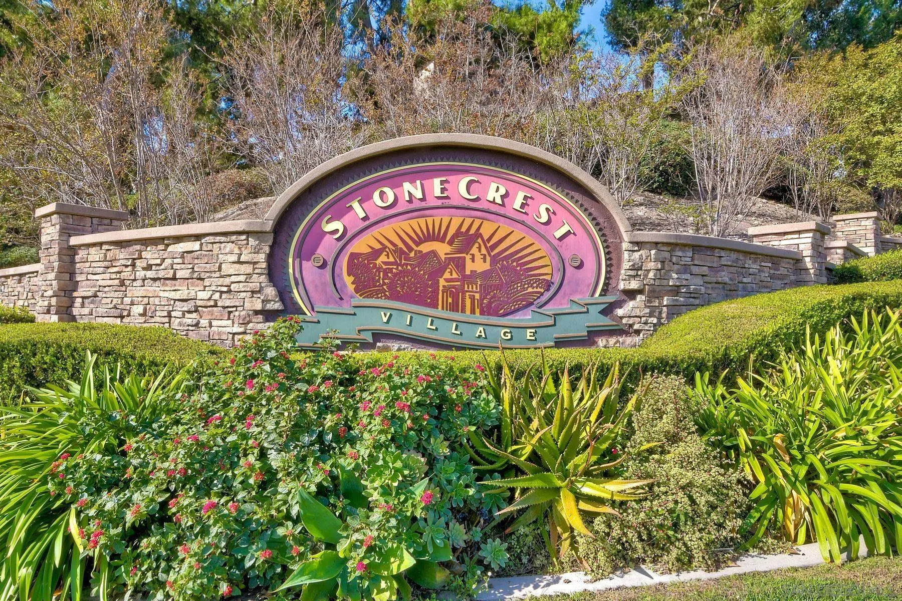 9633 Stonecrest Boulevard San Diego, CA 92123 - Photo 41 of 45 a sign that is on a brick wall