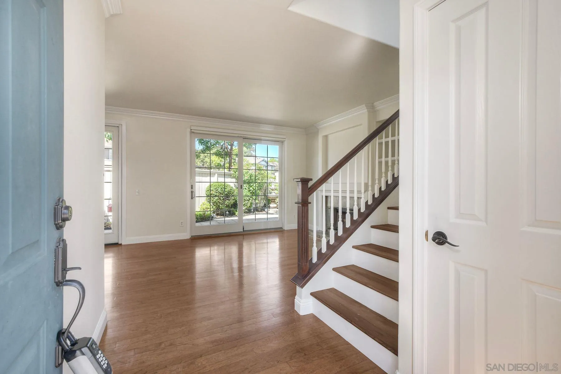 9633 Stonecrest Boulevard San Diego, CA 92123 - Photo 5 of 45 a view of entryway with wooden floor and stairs