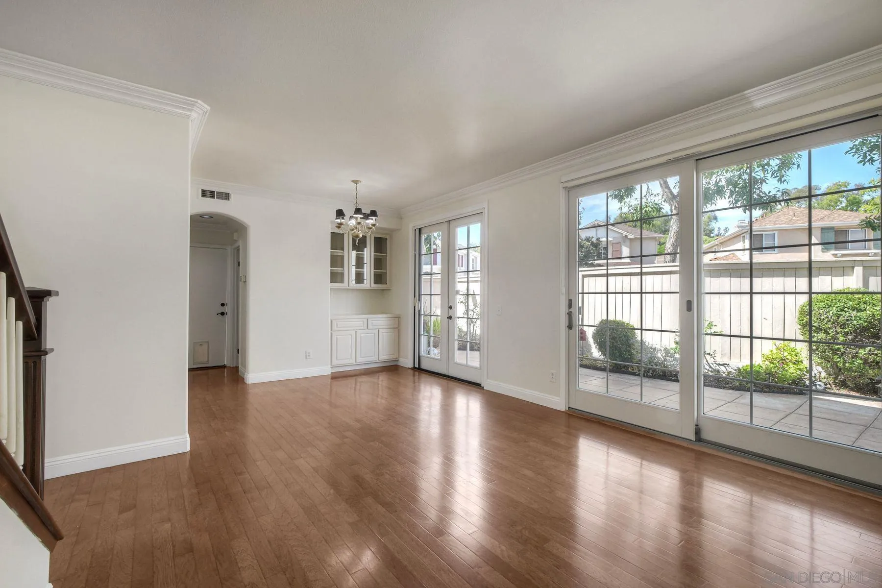9633 Stonecrest Boulevard San Diego, CA 92123 - Photo 10 of 45 wooden floor in an empty room with a window