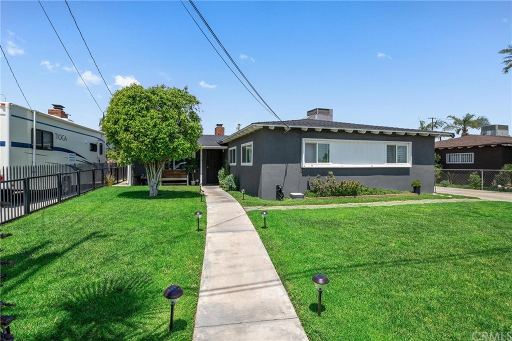 430 East Rialto Avenue Rialto, CA 92376 - Photo 1 of 1 a front view of a house with a yard