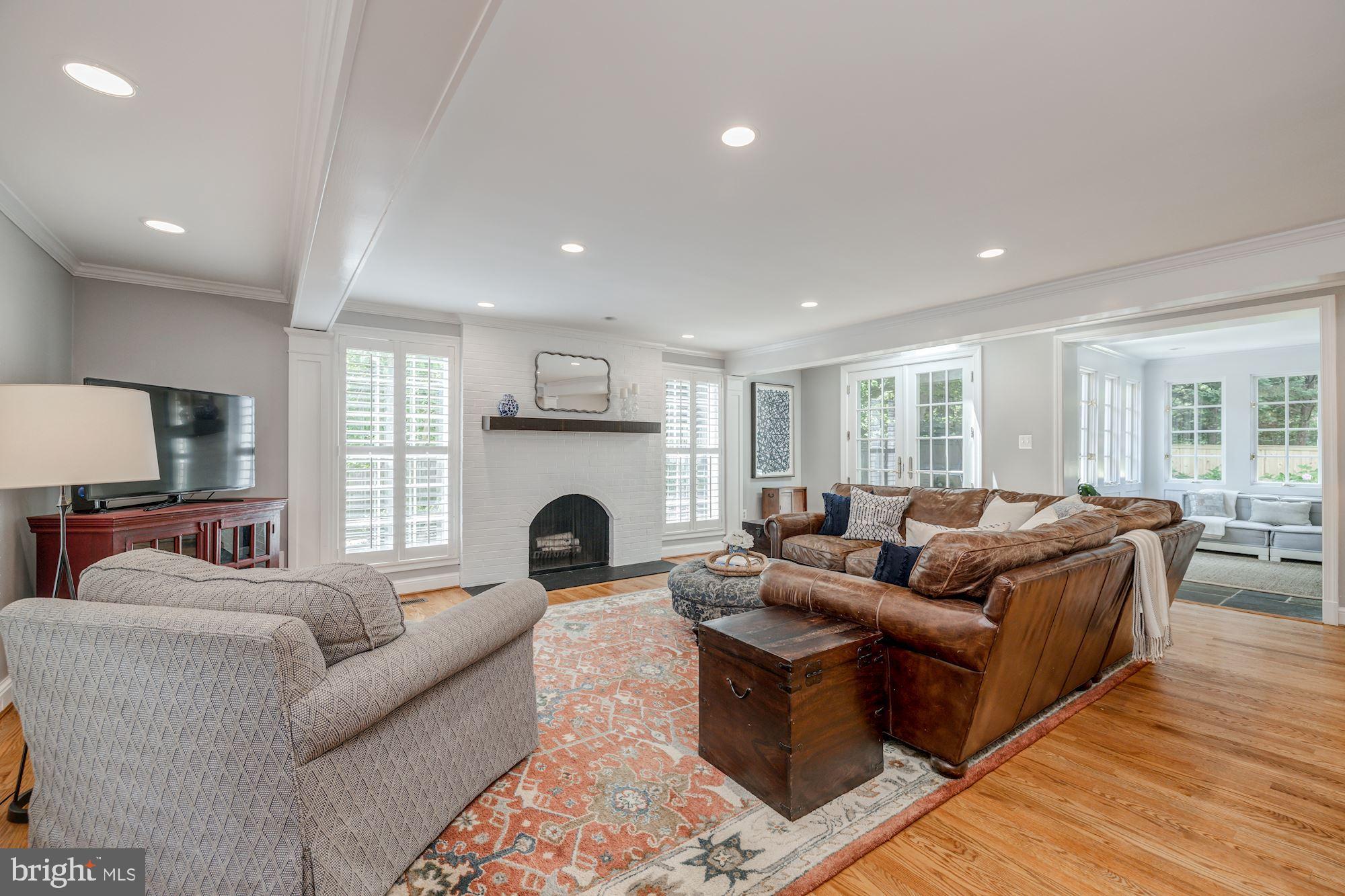 4912 Baltan Road Bethesda, MD 20816 - Photo 13 of 36 Expansive family room with wood-burning fp