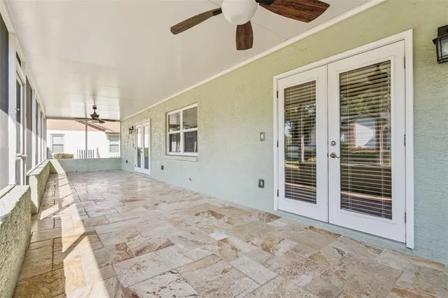 a view of a house with wooden floor and a ceiling fan