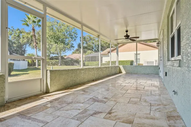 a view of a porch with a floor to ceiling windows with wooden floor