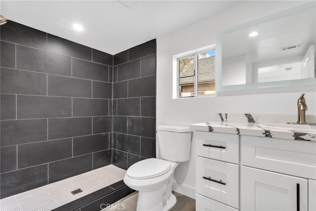 3635 Locust Street Riverside, CA 92501 - Photo 19 of 25 a bathroom with a sink toilet and shower
