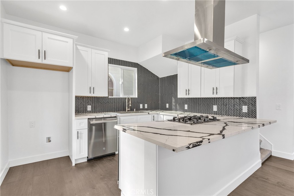 3635 Locust Street Riverside, CA 92501 - Photo 7 of 25 a kitchen with a stove a sink and a refrigerator