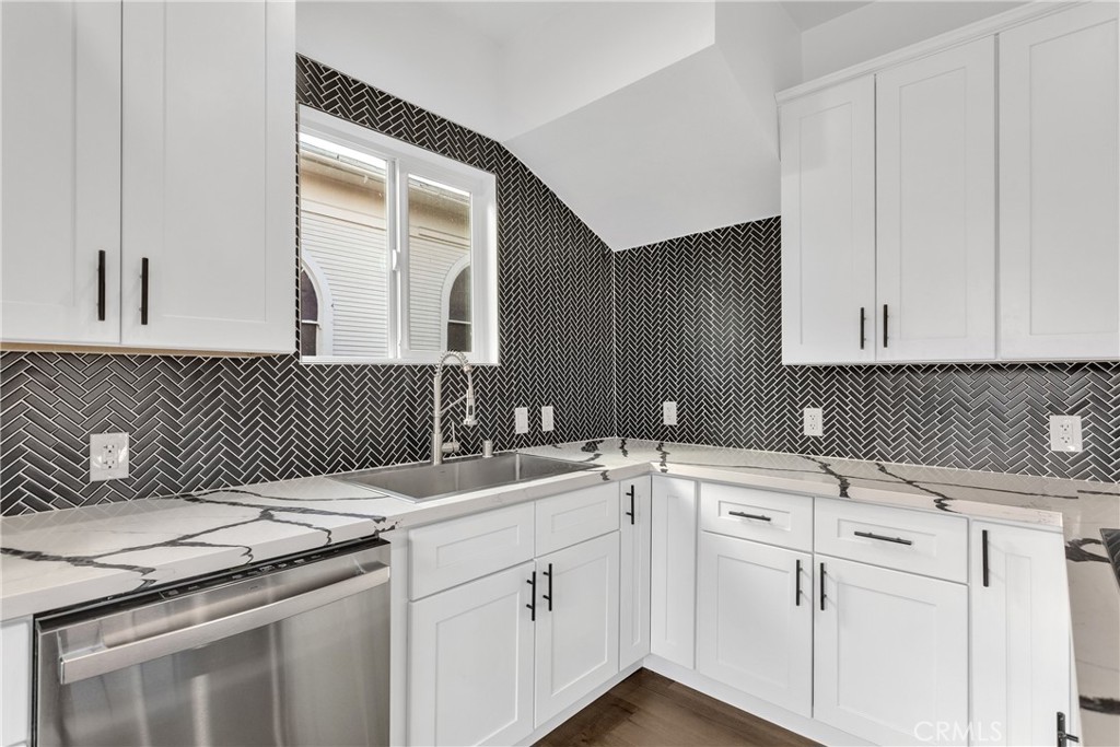 3635 Locust Street Riverside, CA 92501 - Photo 8 of 25 a kitchen with a sink stove and cabinets