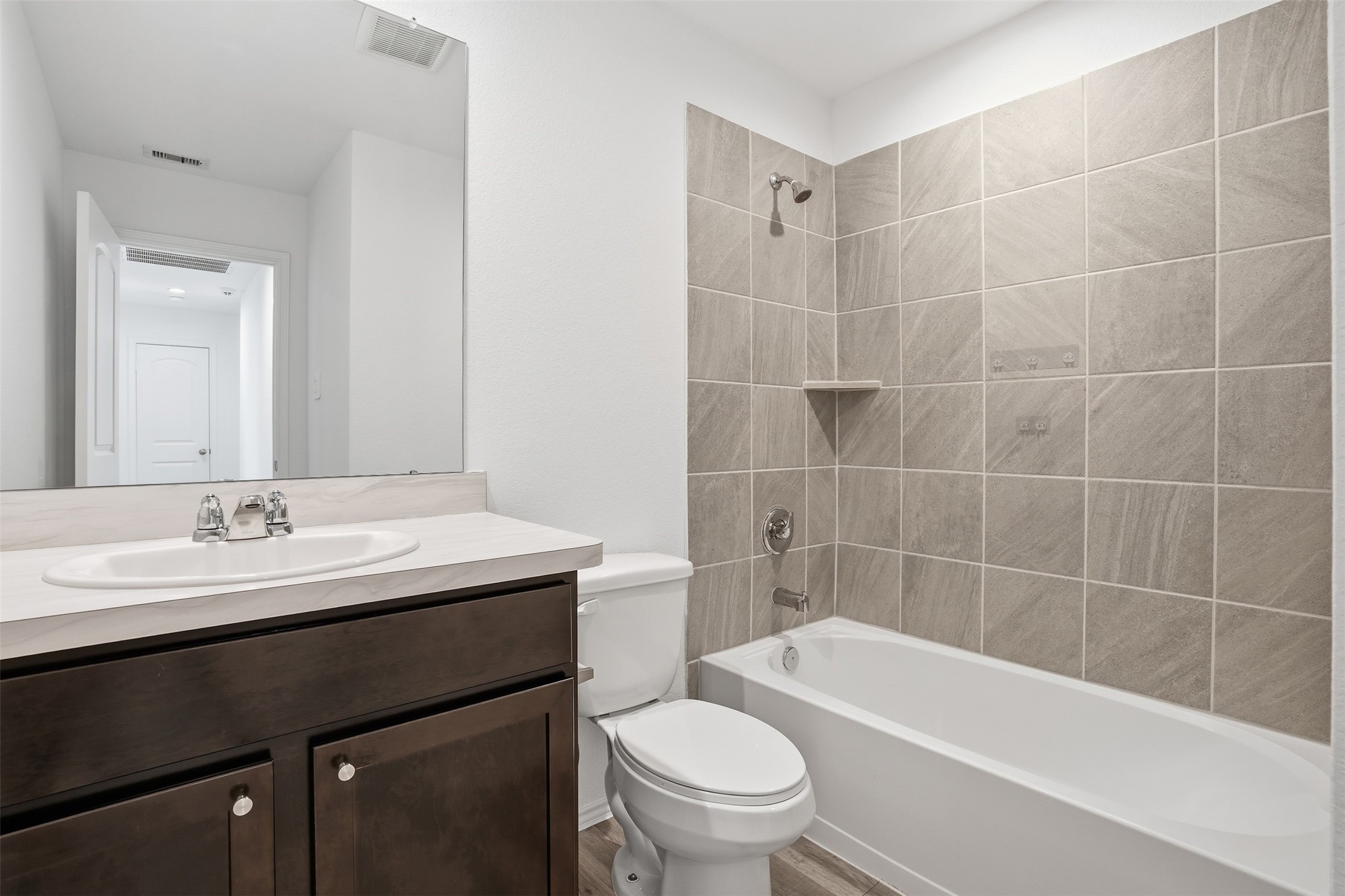 12214 Ridge River Lane Houston, TX 77067 - Photo 18 of 21 a bathroom with a sink a toilet and bathtub