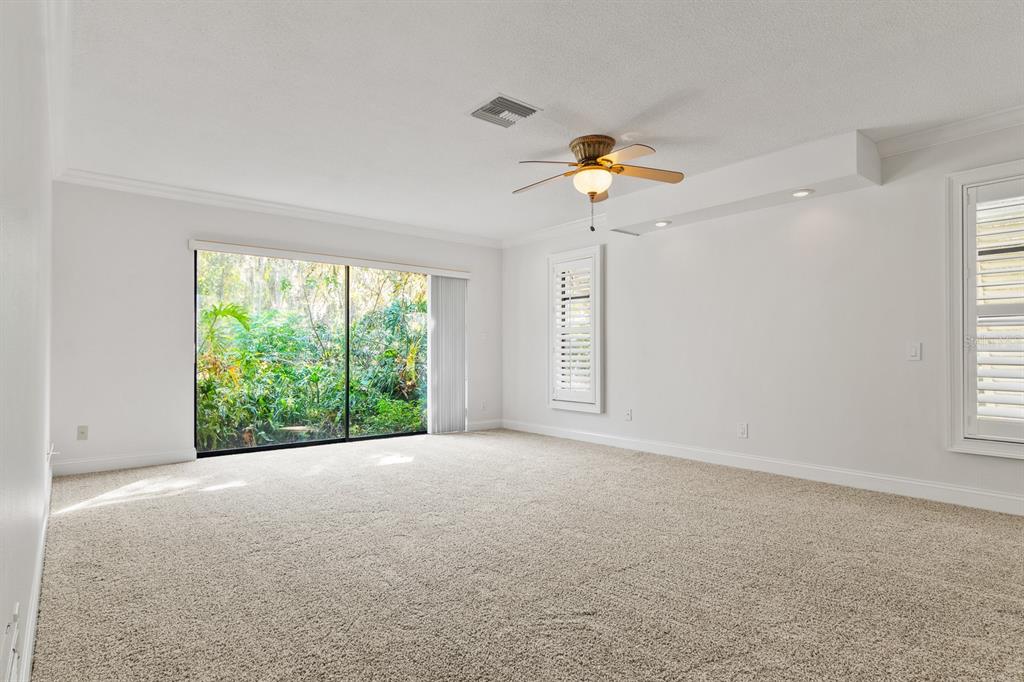 10206 Lakeview Drive New Port Richey, FL 34654 - Photo 24 of 53 wooden floor in an empty room with a window