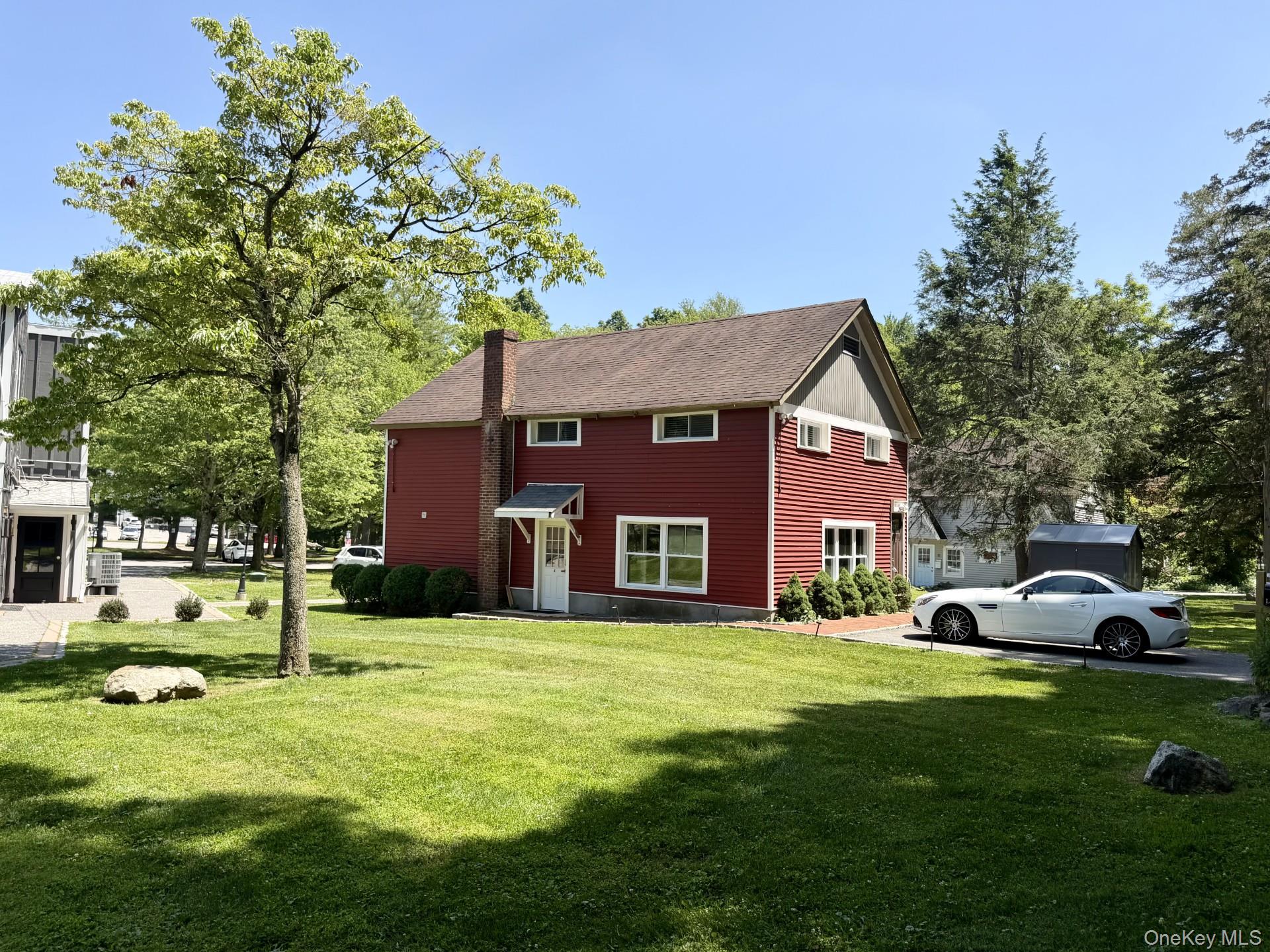 4 Lower Trinity Pass Road Pound Ridge, NY 10576 - Photo 1 of 29 a view of a house with a big yard and large trees