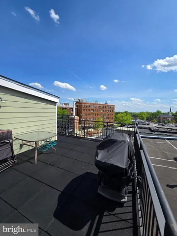 a view of a balcony with chairs