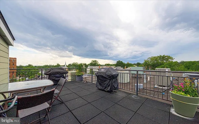 a view of a hallway to rooms