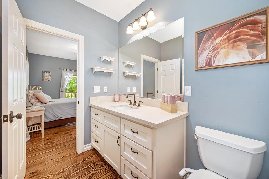 3557 Val Verde Road Loomis, CA 95650 - Photo 34 of 71 a spacious bathroom with a toilet a sink and a mirror