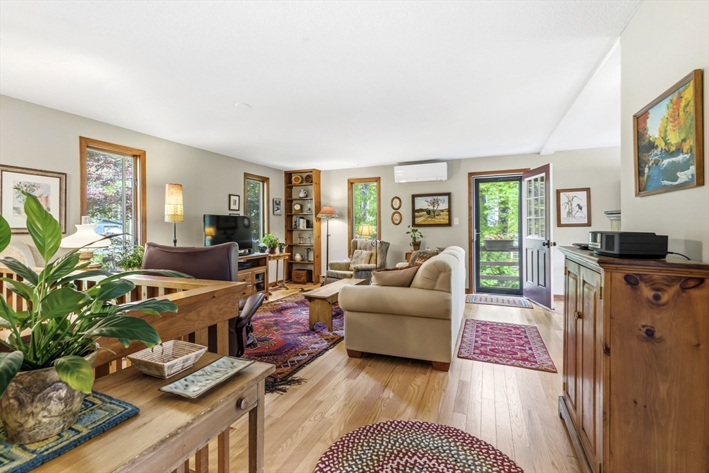 788 Burts Pit Road Northampton, MA 01062 - Photo 13 of 42 a living room with furniture fireplace and a window