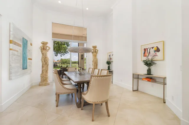 a large kitchen with stainless steel appliances granite countertop a refrigerator and a stove