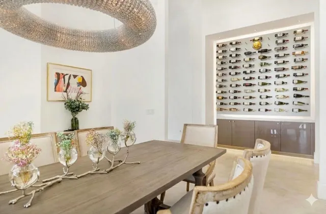 a large white bathroom with a large tub and sink