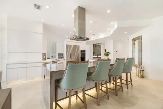 a living room with furniture chess board and a rug