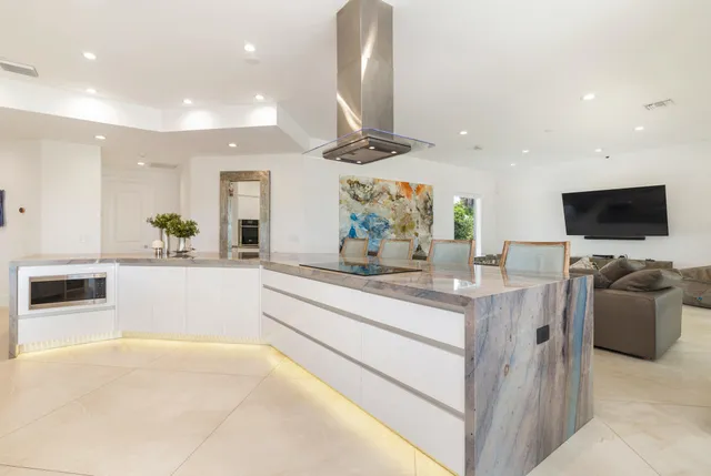 a bathroom with a sink a mirror and a shower