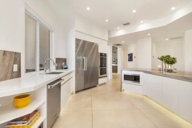 a bathroom with a sink a mirror and a shower