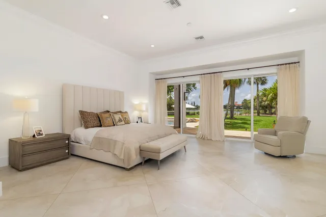 a view of a house with swimming pool and a chairs