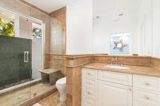 a front view of a house with a yard and a garage