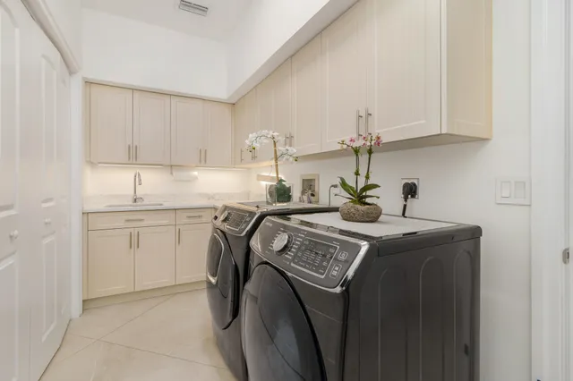 an aerial view of a house with a yard and lake view