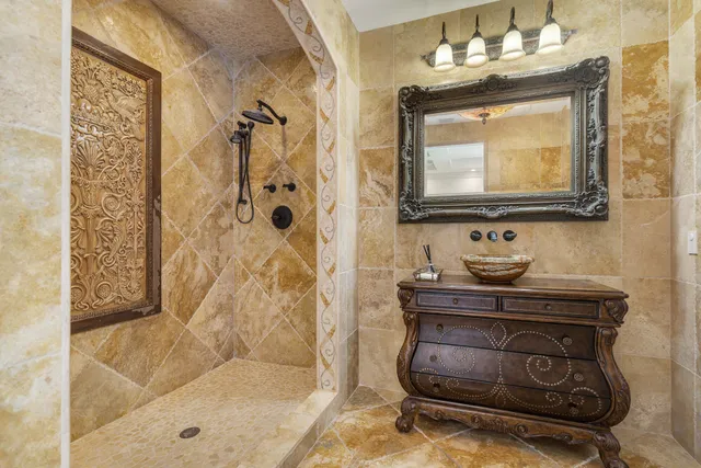 an aerial view of a house with a yard and lake view