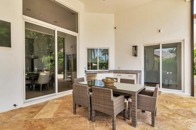 an aerial view of a house with yard swimming pool and outdoor seating