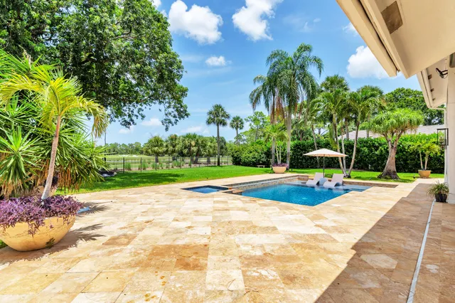 a view of a lake with houses in the back