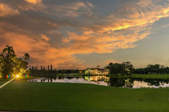 a view of a swimming pool with a yard