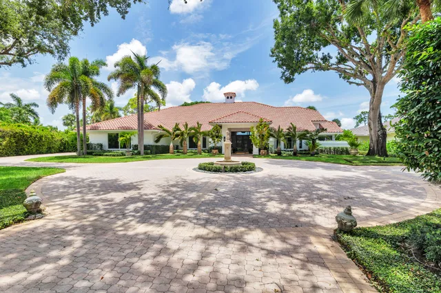 a living room with furniture large window and fireplace