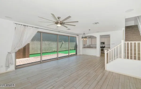 a view of an entryway with wooden floor