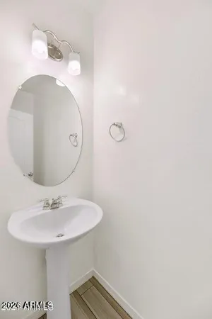 a bathroom with a sink and mirror