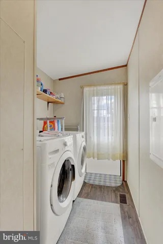 a view of livingroom with washer and dryer